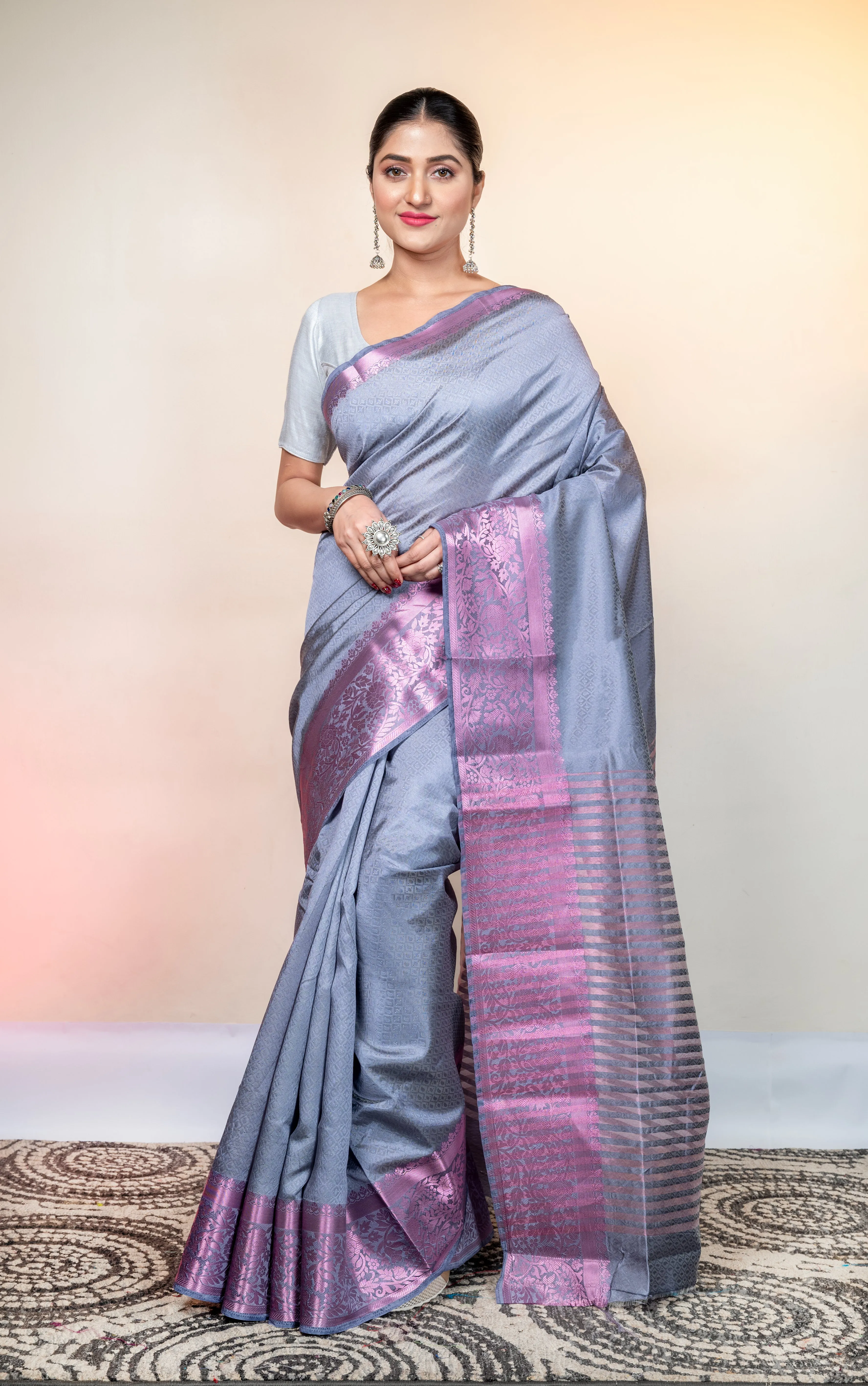 Women Grey Kanjivaram Soft Silk Saree With Pink Stripe Pallu And Woven Motifs